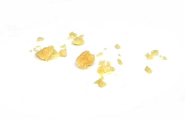 Fototapeta premium Pieces of parmesan cheese isolated on white background. Parmesan crumbs on white. 