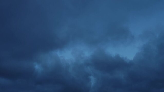Sky with curious blue-green clouds at dawn