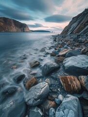 serene rocky seashore with smooth water surface surrounded by steep cliffs