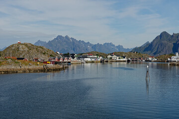 Fototapeta na wymiar View of fishing village with magnificent mountain range in the background