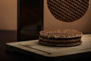 Stack of dutch waffles with caramel isolated on white background