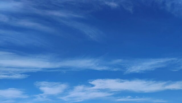 Blue sky full of large cirrus clouds in the morning