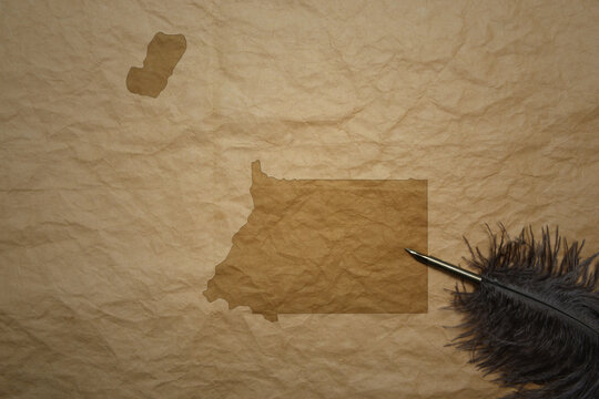 map of equatorial guinea on a old paper background with old pen