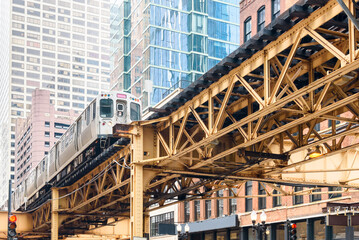 Train on elevated rail tracks in downtown Chicago on a spring day