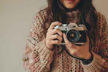 Woman holds a vintage camera for content creation. Generative AI