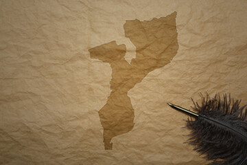 map of mozambique on a old paper background with old pen