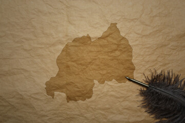 map of rwanda on a old paper background with old pen