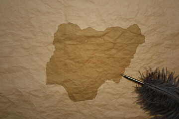 map of nigeria on a old paper background with old pen