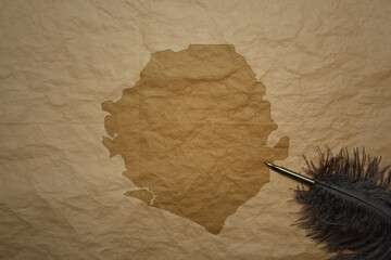 map of sierra leone on a old paper background with old pen