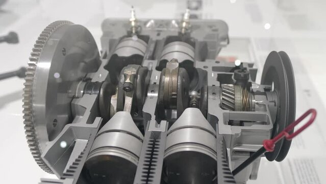 Air-cooled four-cylinder, Boxer flat engine parts move display, retro-style, history automotive industry, Germany, engineering solutions used in boxer engines