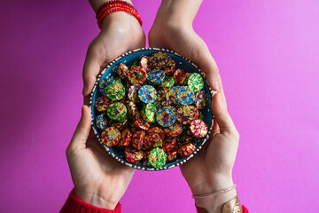Top View Image of Woman Hand Holding Bowl of Candies. Ramadan Feast Celebration Concept, Colorful...