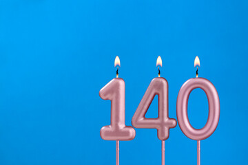 Birthday card with number 140 - Burning anniversary candle on blue background
