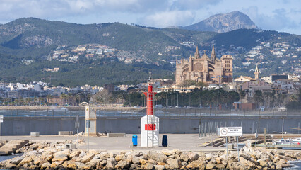 Majestic Cathedral of Palma Framed by Lush Hills and a Marina Beacon, Mallorca - 755211525