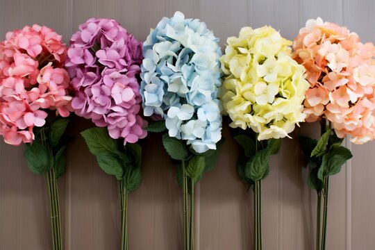 Delicate Six artificial hydrangeas. Floral colorful decoration in glass vases. Generate ai