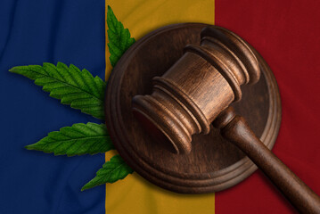 Gavel and cannabis leaf on the Romania flag. The concept of legalization of marijuana in Romania.