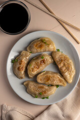Plate with gyoza, dumplings with soy sauce.