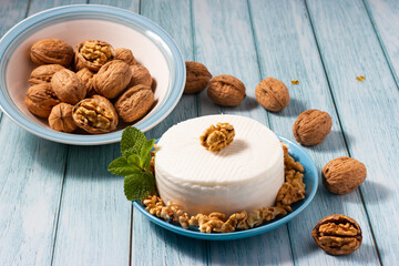 Healthy food. Fresh goat cheese and nuts.