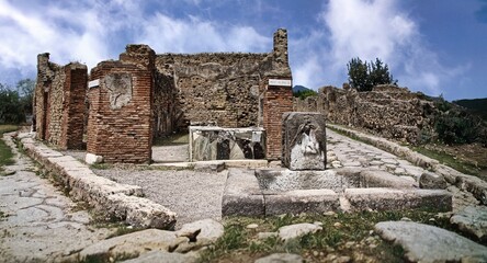 Fototapeta na wymiar Some beautiful, perfectly preserved houses of the ancient city of Pompeii (Naples, Italy) destroyed by the eruption of Vesuvius in 79 BC