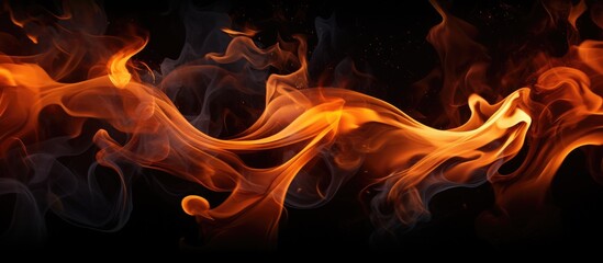 Fire flames are seen burning fiercely against a stark black background, emitting a bright and intense glow. The flames flicker and dance in intricate patterns, showcasing their raw power and energy.