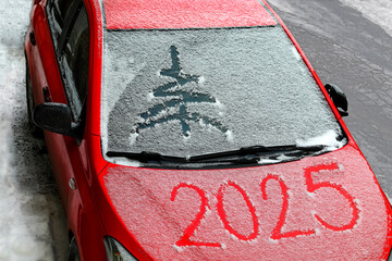 snow-covered car with the inscription 2025