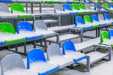 bleachers chairs under the snow - 755232134