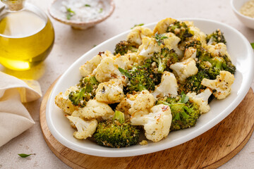 Roasted cauliflower and broccoli on a serving plate, healthy vegetable side dish - 755236980