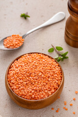 Red lentils raw in a bowl ready to be cooked - 755237540