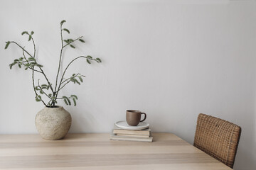Spring, Easter breakfast still life. Elegant Scandinavian living room, home office. Cup of coffee,...