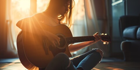 A woman with long flowing hair sits on the floor, strumming a guitar with intense focus and passion.