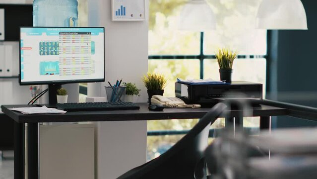 Computer screen in financial department office shows stock exchange indices changing in real time. Desktop PC monitor in workplace with trading indexes showing latest price modifications, panning shot