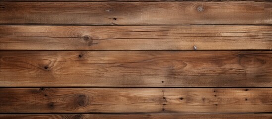 A detailed view of a wooden plank wall, showcasing the texture and grain of the wood. Each plank is fit tightly together, creating a seamless and solid structure.