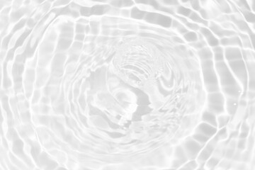 Fototapeta na wymiar White water surface texture with ripples, splashes, and bubbles. Abstract summer banner background Water waves in sunlight with copy space cosmetic moisturizer micellar toner emulsion. White water.