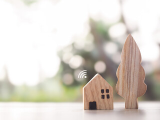 Miniature house with Wifi signal. The concept of network connect, internet of things, smart home...
