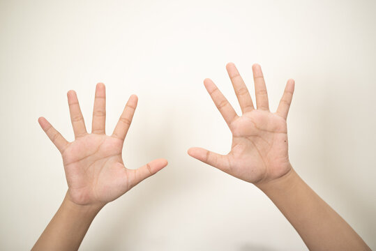 Hand pointing at something and make a sign on white background