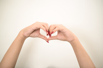 Hand use nails art pointing at something and make a sign on white background