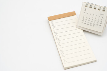 Blank Check list or Empty small notepad with checkbox and Simple desk calendar for MAY 2024. Blank checklist for text. Copy Space.