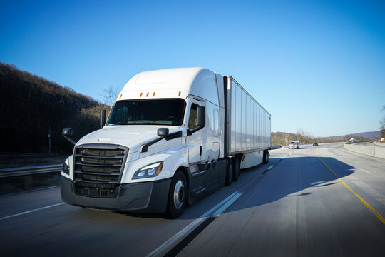 18-wheeler semi-truck delivering on the highway