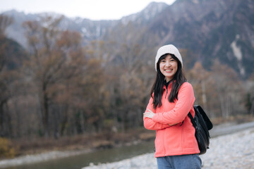 Adventure portrait, Asian woman in a pink fleece explores Japan's snowy destination. Elegant...