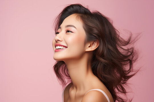 side view of pretty young asian woman smile