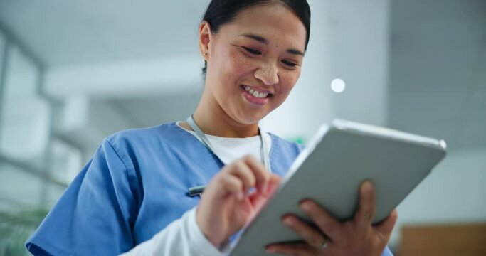 Happy, asian woman and nurse with tablet for research, healthcare or social media at hospital. Female person, medical worker or employee with smile on technology for communication or online search