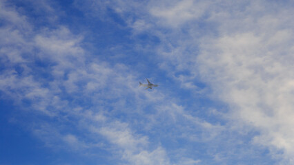 Light in the clouds in the blue sky,  Sky clouds, Beautiful clouds movement in the sky, and airplane.