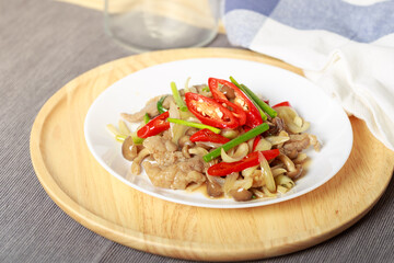 Stir-fried Beef with Oyster Sauce, Thai style food, rich flavor consisting of mushrooms, onions, chilli and spring onions.