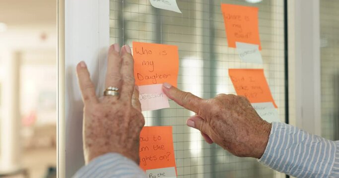 Person, hands and notes for alzheimer remember for memory loss problem or help, amnesia or dementia. Paper, fingers and recall for cognitive exercise on glass wall or healthcare, assistance or crisis