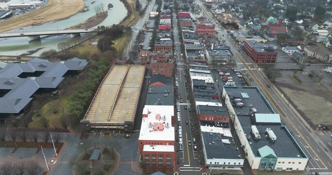 Corning, NY, USA - 03-02-2024 - Cloudy winter aerial video of the downtown area in the City of Corning, NY, year round activity.	