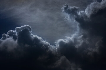 Dramatic dark storm thundercloud rain clouds on black sky background. Dark thunderstorm clouds...