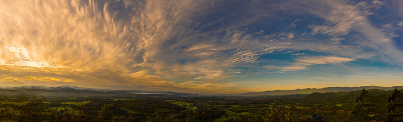 Banner Scenic view dramatic beautiful sunset sky. Panorama Natural Sunset Sunrise on meadow silhouette shadow dark land. Vibrant dramatic sky in Countryside. Landscape Sky At Sunset with copy space