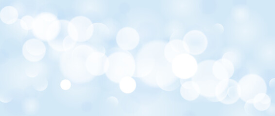 Abstract bokeh and sparkle wallpaper. Smooth soft blue blur effect background. Shiny blurry light circles texture. Seasonal backdrop for Christmas, New Year or birthday card, poster, banner. Vector © vika_k