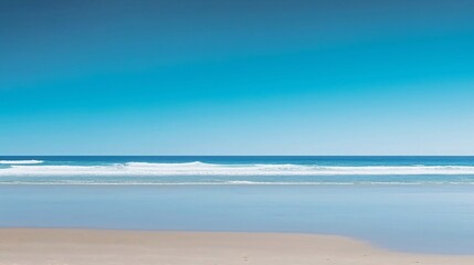 Fototapeta na wymiar 静かな青い海の砂浜、余白・コピースペースのある夏の背景