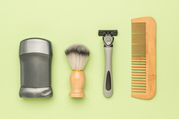 A set of men's hygiene items on a light green background.