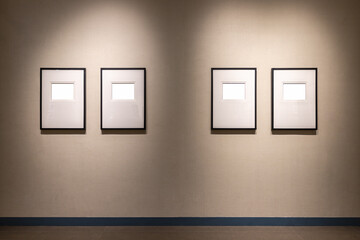 four blank frames on a wall
